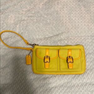 Coach Yellow Clutch with Decorative Buckles and Wrist Strap